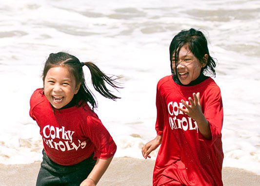 Girls Running at Corky Carroll's Beach Adventure Summer Camp